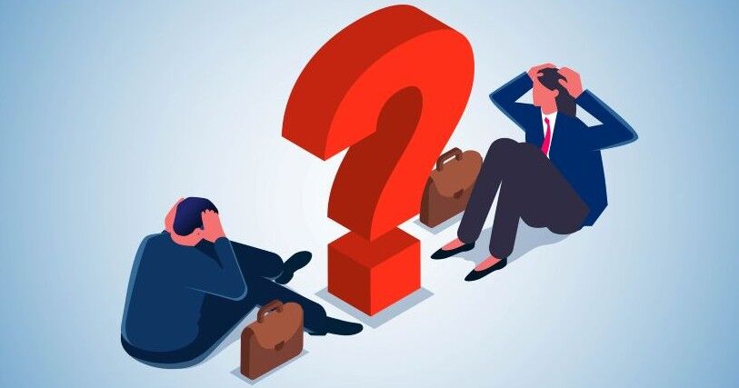 Two figures, dressed in black pants and blue jackets, sit with hands to their heads in confusion, looking at a tall red question mark