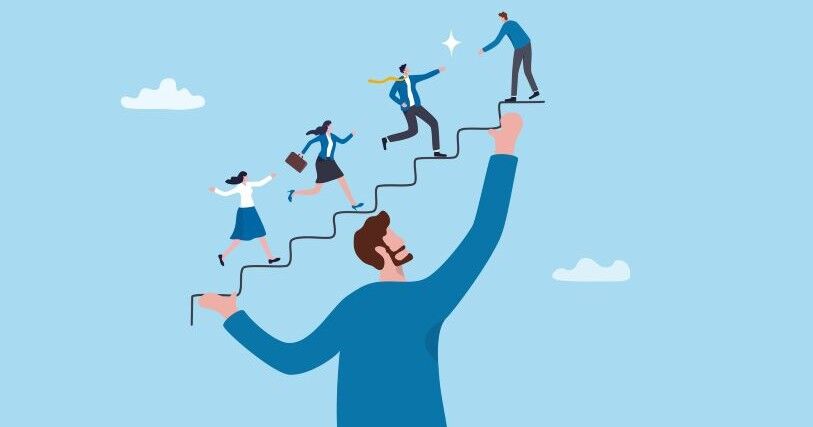 Against a blue background, a bearded man supports employees growth, symbolized by a staircase he holds. Employees dressed in blue and white ascend the staircase.