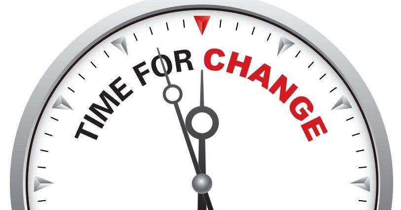 A stopwatch shows hands at 2 minutes to 12 with the words 'time for change'
